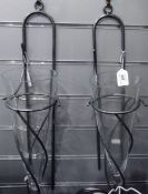 Pair of glass and metal wall sconces