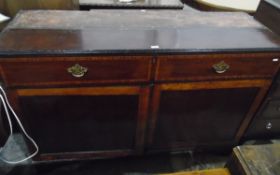 Mahogany and satinwood cross-banded cupboard with long frieze drawer and a pair of panel cupboards