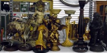 Pair of tall painted wooden candlesticks, a pair of candlesticks modelled as cherubs,