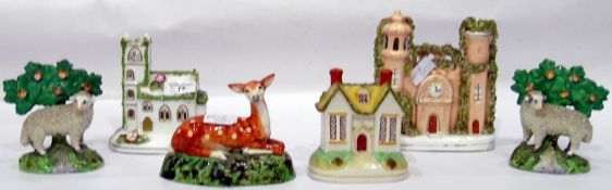 19th century flatback pottery clock spill vase, a pair of Staffordshire model sheep,