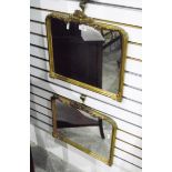 Pair of moulded gilt framed wall mirrors with foliate borders,