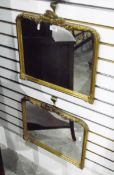 Pair of moulded gilt framed wall mirrors with foliate borders,