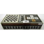 Middle Eastern inlaid travelling backgammon and chessboard with bone and plastic counters, 26.