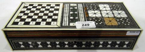 Middle Eastern inlaid travelling backgammon and chessboard with bone and plastic counters, 26.