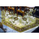 20th century machine made wool rug of octagonal form, the cream ground with yellow,