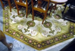 20th century machine made wool rug of octagonal form, the cream ground with yellow,