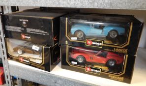 Collection of Burago diecast model cars in window boxes