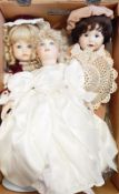Three 20th century bisque headed child dolls with fixed eyes, painted mouths,