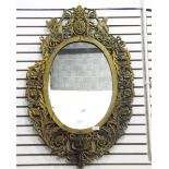 Oval wall mirror within a foliate fret frame,