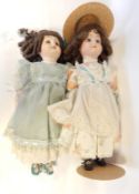 Three Lillian Middleton bisque head child dolls with fixed eyes and painted mouths,