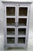 White painted dwarf kitchen cabinet enclosed by two glass panelled doors,