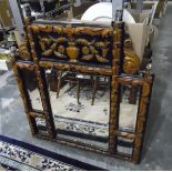 Carved wood overmantel mirror with carving of urn and flowers over a bevelled mirror,
