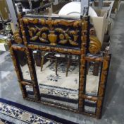 Carved wood overmantel mirror with carving of urn and flowers over a bevelled mirror,