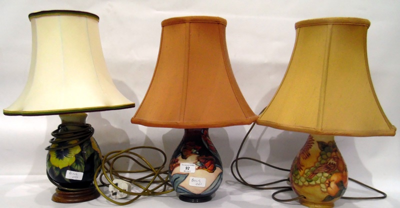 Three Moorcroft lamp bases with shades