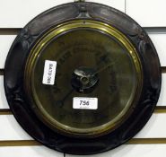 20th century circular aneroid barometer, in carved oak frame,