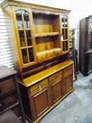 Modern cherrywood kitchen dresser, the upper section with open shelves,