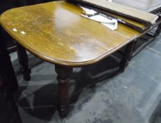 Old oak wind-out dining table with moulded edge, on turned baluster legs, with two extra leaves,