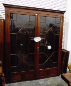 Georgian-style mahogany glazed bookcase with dentil cornice,