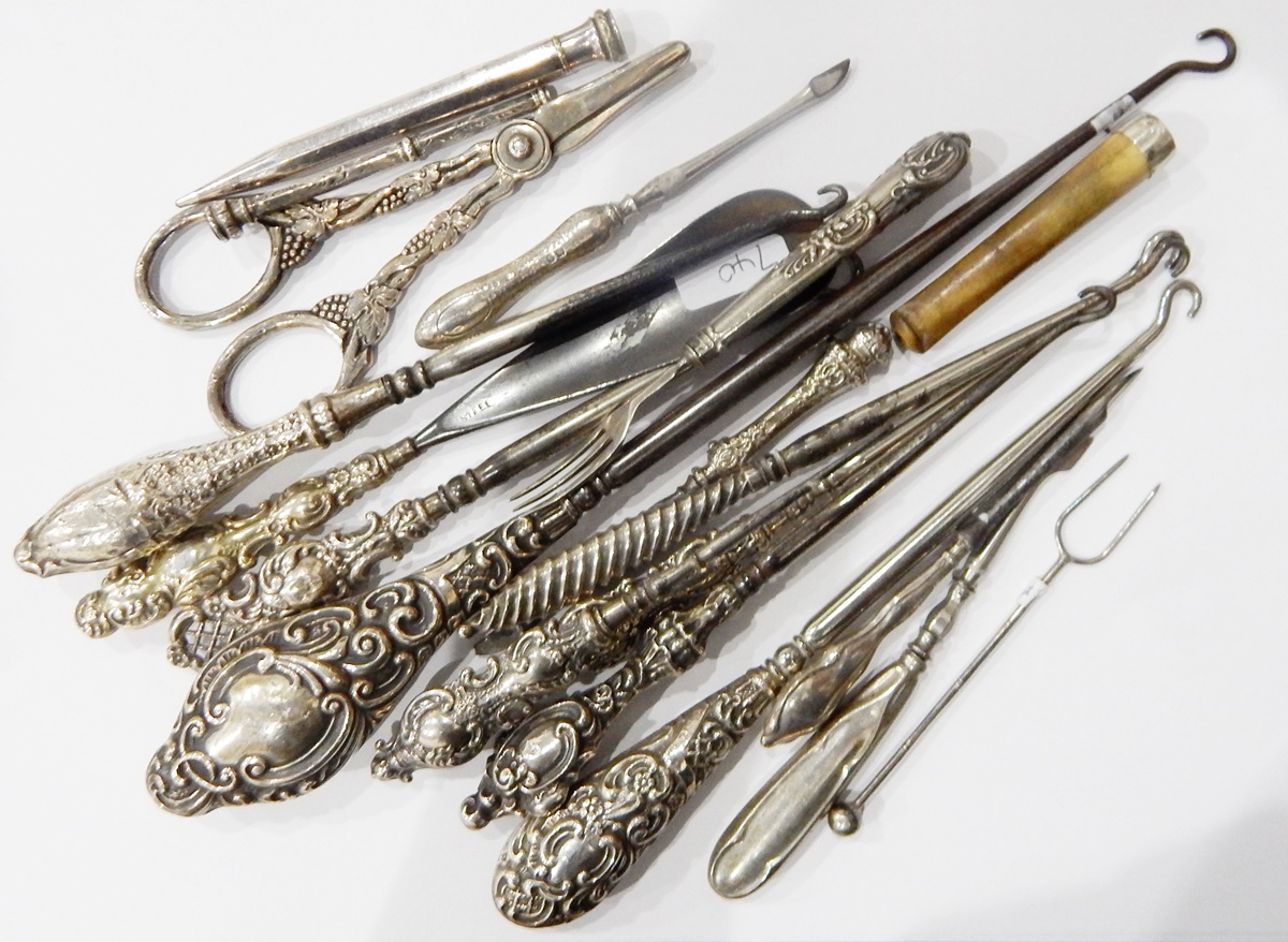Quantity of silver-handled button hooks, propelling pencils, silver-mounted cheroot holder,