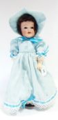 BND London doll with fixed blue eyes, open mouth, in blue dress, on stand marked BND London,