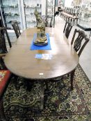 Reproduction mahogany and cross-banded extending twin-pedestal dining table