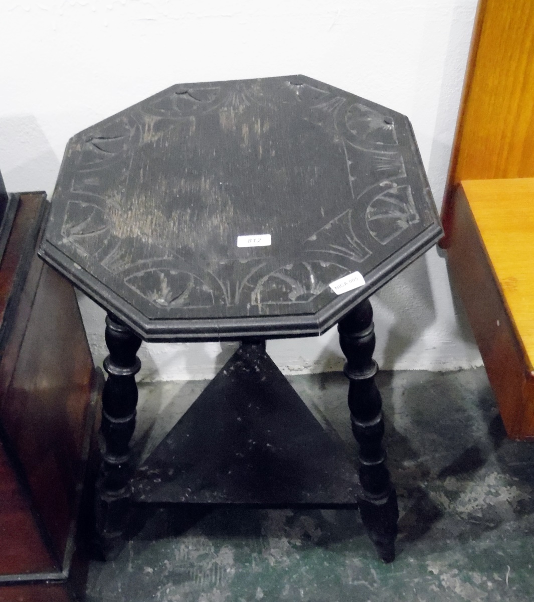 Late Victorian ebonised octagonal two-tier table on turned supports and with under-tier