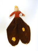 Norah Wellings cloth doll of boy in a mustard cap