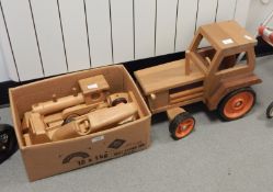 Modern wooden model of a tractor and other wooden toys