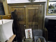 19th century pine kitchen cupboard, the pair of panelled doors enclosing shelves,