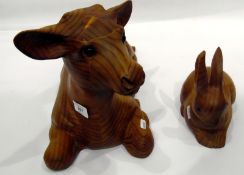 Carved wooden model of a seated cow by David H William,