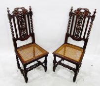 Pair of early 20th century cane seated oak-framed standard chairs with carved splat and on spiral