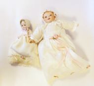 Various miniature baby dolls in baskets,