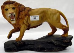 Beswick model lion on a stylised rock base,