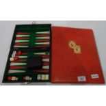 Folder and contents of all world stamps and a travelling backgammon set (2)