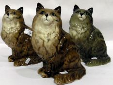 Three Beswick model cats,