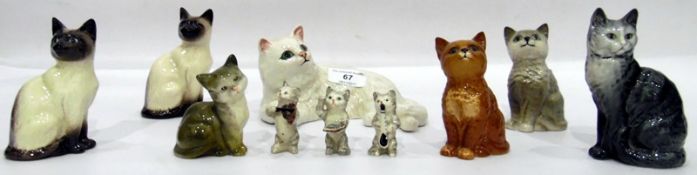 Beswick model white cat and various other Beswick model cats including a pair of small Siamese cats