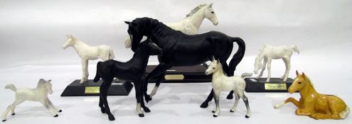 Beswick model dapple grey horse on wooden plinth base, two Beswick model black horses,