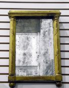 Rectangular gilt-framed mirror with column and leaf decoration,