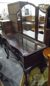 Chippendale-style mahogany serpentine-front mirror-back dressing table with gadrooned border,