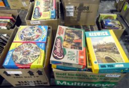 Three boxes of assorted jigsaw puzzles including Waddingtons circular jigsaws,