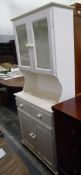 Modern white painted kitchen dresser with glazed cupboard above enclosing adjustable shelves,