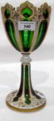 19th century overlay green pedestal goblet, cased in opaque white and gilt highlights,