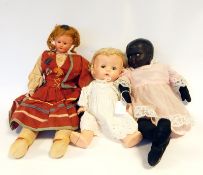 Assorted modern dolls in leather suitcase
