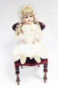 Lillian Middleton bisque headed girl doll, closed mouth, fixed brown eyes, inscribed LM86 Stow,