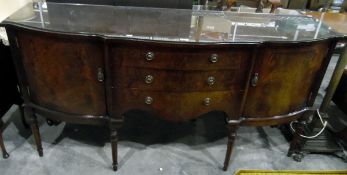 Georgian-style mahogany serpentine-front sideboard with three central drawers, flanked by cupboards,