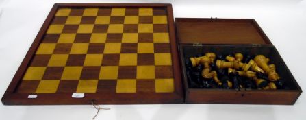 Wooden chess board and rectangular wooden box containing a set of wooden chess pieces