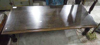 Dark stained oak rectangular magazine/coffee table with moulded top and on turned supports,