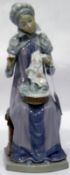 Lladro porcelain figure of lady in medieval dress, seated with sewing,