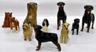 Various Beswick model dogs to include a black labrador, spaniel,