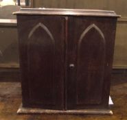 Late Victorian oak small cabinet with moulded edge top,
